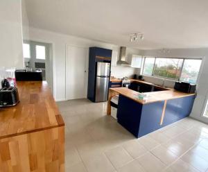 a kitchen with a counter top and a refrigerator at No 4 Giles in Kingscote