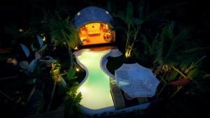 a night view of a house with a light on it at Gladak di Uma Bali in Sidemen
