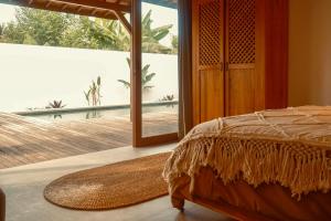 Postel nebo postele na pokoji v ubytování Palm Paradise Lembongan