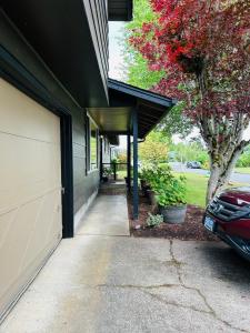 a driveway leading to a house with a garage at Emerald City 3 Bedroom 1 bath Home in Eugene