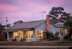a house with a chimney on the side of it at Castaway Cottage in Dover