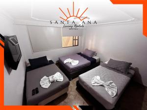 Ένα ή περισσότερα κρεβάτια σε δωμάτιο στο HOTEL SANTA ANA LUXURY RENTALS - Belmira