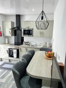Η κουζίνα ή μικρή κουζίνα στο 39 Wells Street Apartment