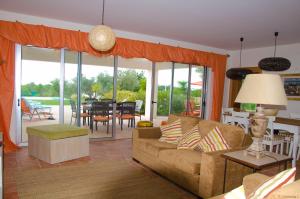 a living room with a couch and a table at Amazing Windmillhouses in Olhão