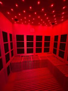 a red room with red lights on the ceiling at Illuminati Guest House in Victoria