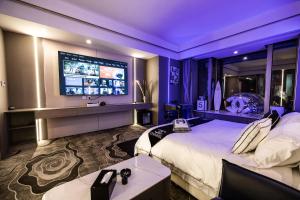 TV a/nebo společenská místnost v ubytování 中山明景