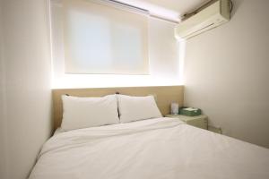 Postel nebo postele na pokoji v ubytování J5 Hostel