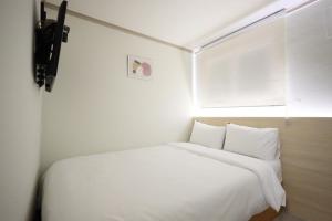 Postel nebo postele na pokoji v ubytování J5 Hostel