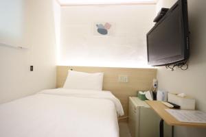 Postel nebo postele na pokoji v ubytování J5 Hostel