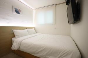 Postel nebo postele na pokoji v ubytování J5 Hostel