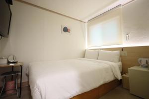 Postel nebo postele na pokoji v ubytování J5 Hostel