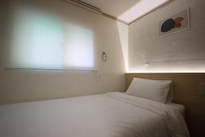 Postel nebo postele na pokoji v ubytování J5 Hostel