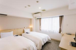 Postel nebo postele na pokoji v ubytování HOTEL　KAMO