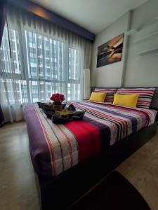 Postel nebo postele na pokoji v ubytování THE BASE apartments at central pattaya