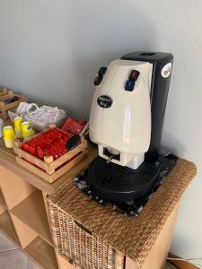 a coffee maker sitting on top of a table at Arcibaleno in Sabaudia