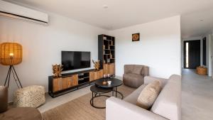 Μια τηλεόραση ή/και κέντρο ψυχαγωγίας στο Dushi Breeze +21 φωτογραφίες