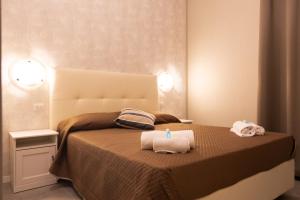 Postel nebo postele na pokoji v ubytování Golden Milano Hotel
