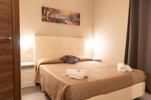 Postel nebo postele na pokoji v ubytování Golden Milano Hotel