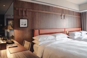 Postel nebo postele na pokoji v ubytování Sheraton Taitung Hotel