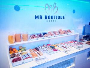 a mr boutiqueastery with many different foods on display at MB Boutique Hotel - Adults Recommended in Nerja