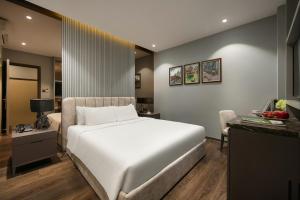 Voodi või voodid majutusasutuse Ping Hotel toas