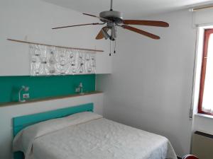 Кровать или кровати в номере L'Ambra