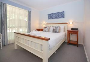 Giường trong phòng chung tại Amber Cottage +18 ảnh