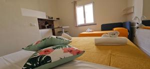 Postel nebo postele na pokoji v ubytování San Vito Accommodations