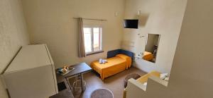 Postel nebo postele na pokoji v ubytování San Vito Accommodations
