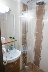 a bathroom with a sink and a shower at My Way Tera Butik Otel in Adalar