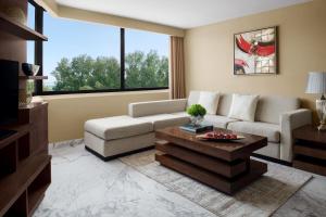a living room with a couch and a coffee table at InterContinental Al Jubail Resort in Al Jubail
