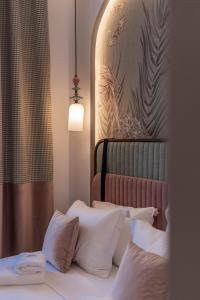 Postel nebo postele na pokoji v ubytování MiraVita Boutique Hotel - Adults Only