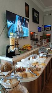 a buffet line with a lot of food on it at Hotel Livin in Tbilisi City