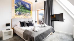 Televízia a/alebo spoločenská miestnosť v ubytovaní Aparthotel Delta Boutique