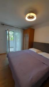 Postel nebo postele na pokoji v ubytování Apartments Anka Pag