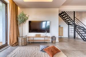 a living room with a table and a large window at La Nostra Villa in Zator