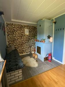 a living room with a couch and a fireplace at Kalmar - Bergavik in Kalmar +42 photos