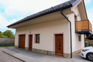 a small house with a balcony at Domen's cozy rentals in Kranj
