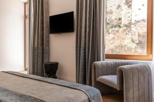 TV a/nebo společenská místnost v ubytování MiraVita Boutique Hotel - Adults Only
