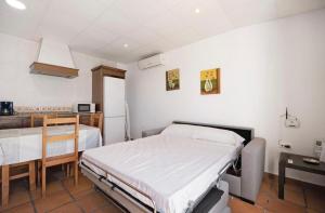 a hospital room with a bed and a table at Novobarrosa Apartamentos Turísticos in Chiclana de la Frontera +67 photos