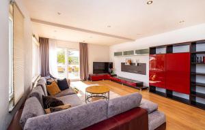 a living room with a couch and a table at Villa Maslina in Sikovo