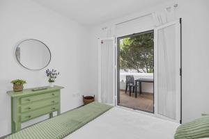 Ένα ή περισσότερα κρεβάτια σε δωμάτιο στο Apartamento El Ancla +21 φωτογραφίες