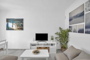 Μια τηλεόραση ή/και κέντρο ψυχαγωγίας στο Apartamento El Ancla