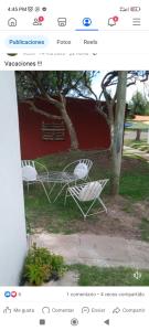 a page of a website with two white chairs at Alojamiento in Fray Bentos