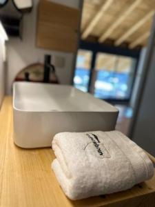 a white towel sitting on a counter next to a sink at Moixeró casa en Estavar in Estavar +87 photos
