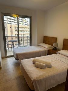Łóżko lub łóżka w pokoju w obiekcie PRIVILEGIO SANTA CLARA 4A
