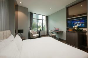 Voodi või voodid majutusasutuse Ping Hotel toas