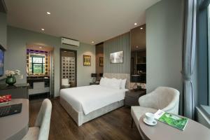 Voodi või voodid majutusasutuse Ping Hotel toas