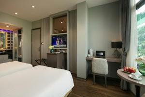 Voodi või voodid majutusasutuse Ping Hotel toas