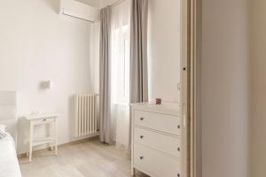 A bed or beds in a room at La Casa di Nonna